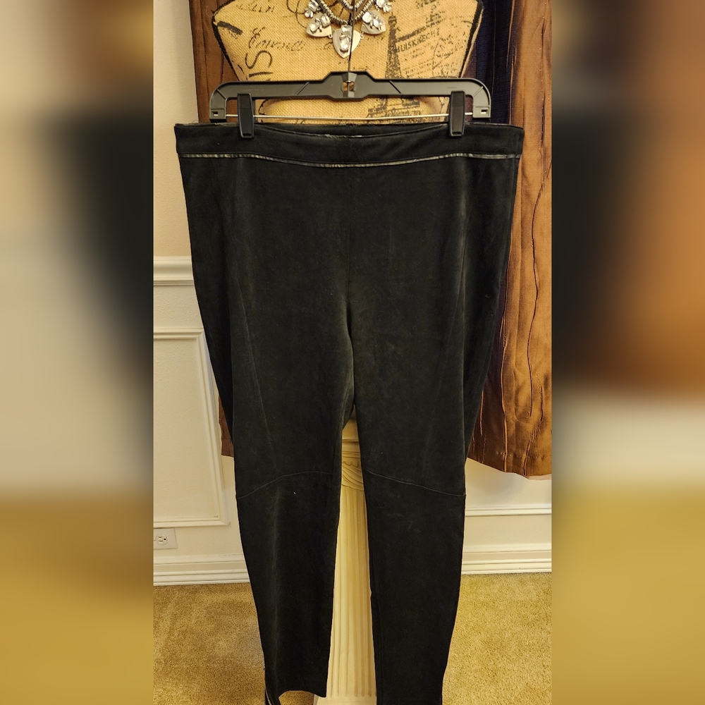 Mirosude Black Straight leg pants with side zippers at the top and ankl zippers.